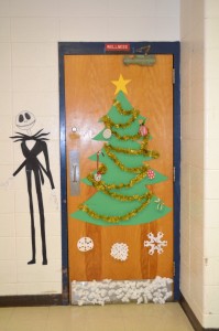 Ms. Linda Curry's seventh period class decorated the locker room doors by the gym. This door shows Jack Skellington, from Tim Burton's The Nightmare Before Christmas, standing next to a Christmas tree.