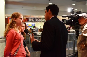 Karly Klem and Jenna Hakun are interviewed by one of the many reporters at the Newseum to cover the 50th anniversary of the JFK assassination.
