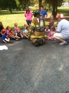 Volunteers teaching the kids at Ms. Bev's Place.