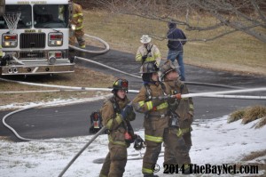 Tristen Plant and senior Dillon Millard fighting a fire. Used by permission of TheBayNet.com